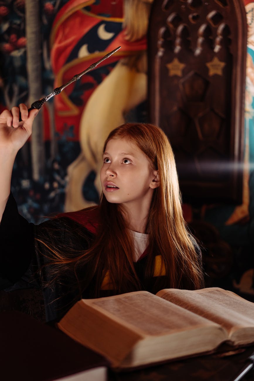 a young girl casting a spell